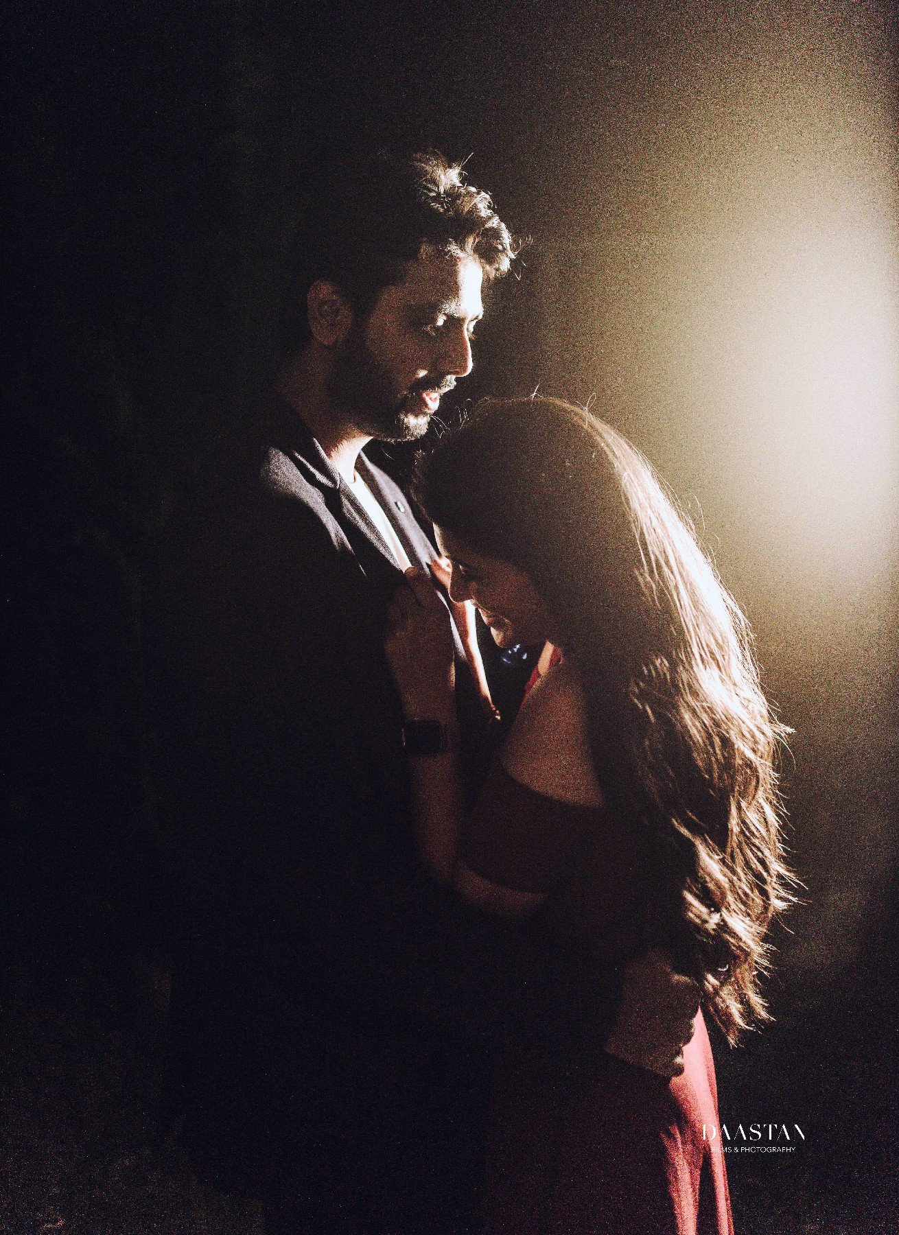 Couple in dramatic dark moody pre-wedding portrait, cinematic photography by Indian wedding production house