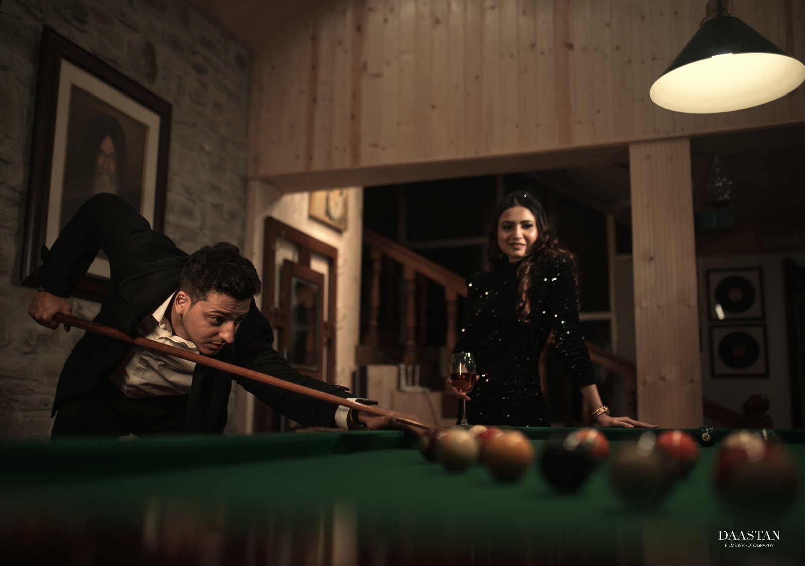 Couple in billiards room during creative indoor pre-wedding shoot, Indian wedding photography