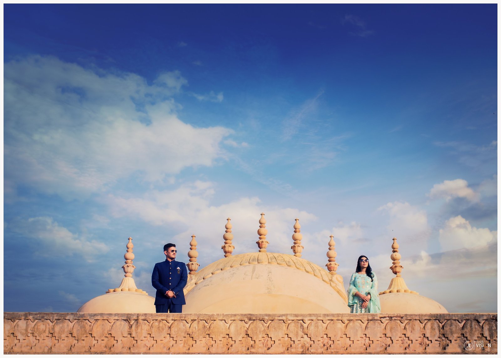 Couple at Buddhist stupa during outdoor pre-wedding shoot, destination Indian couple photography