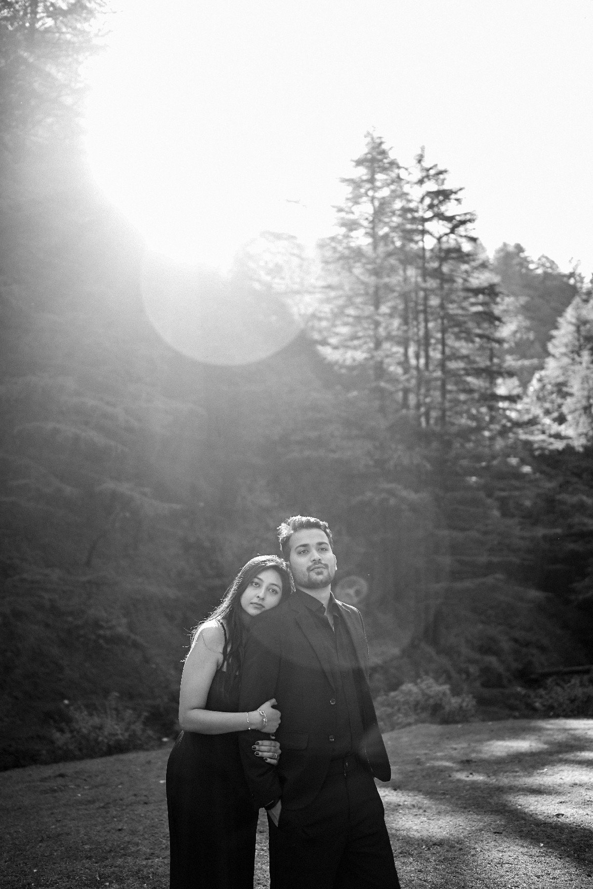 Black and white forest silhouette pre-wedding portrait, cinematic Indian couple photography