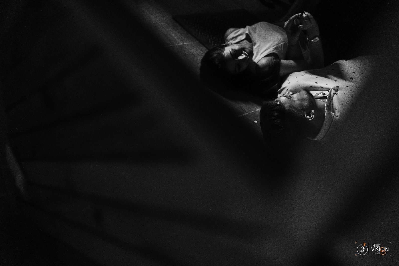 Moody black and white indoor pre-wedding portrait, candid couple photography by Indian production house