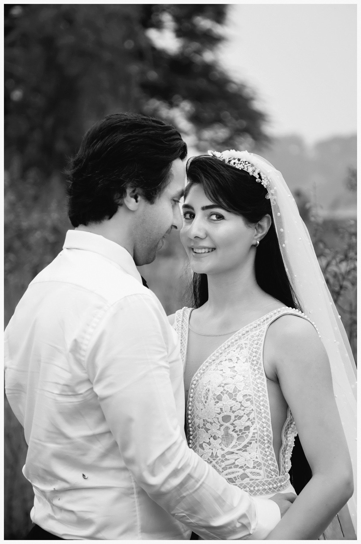 Black and white romantic outdoor pre-wedding portrait of couple, Indian couple photography