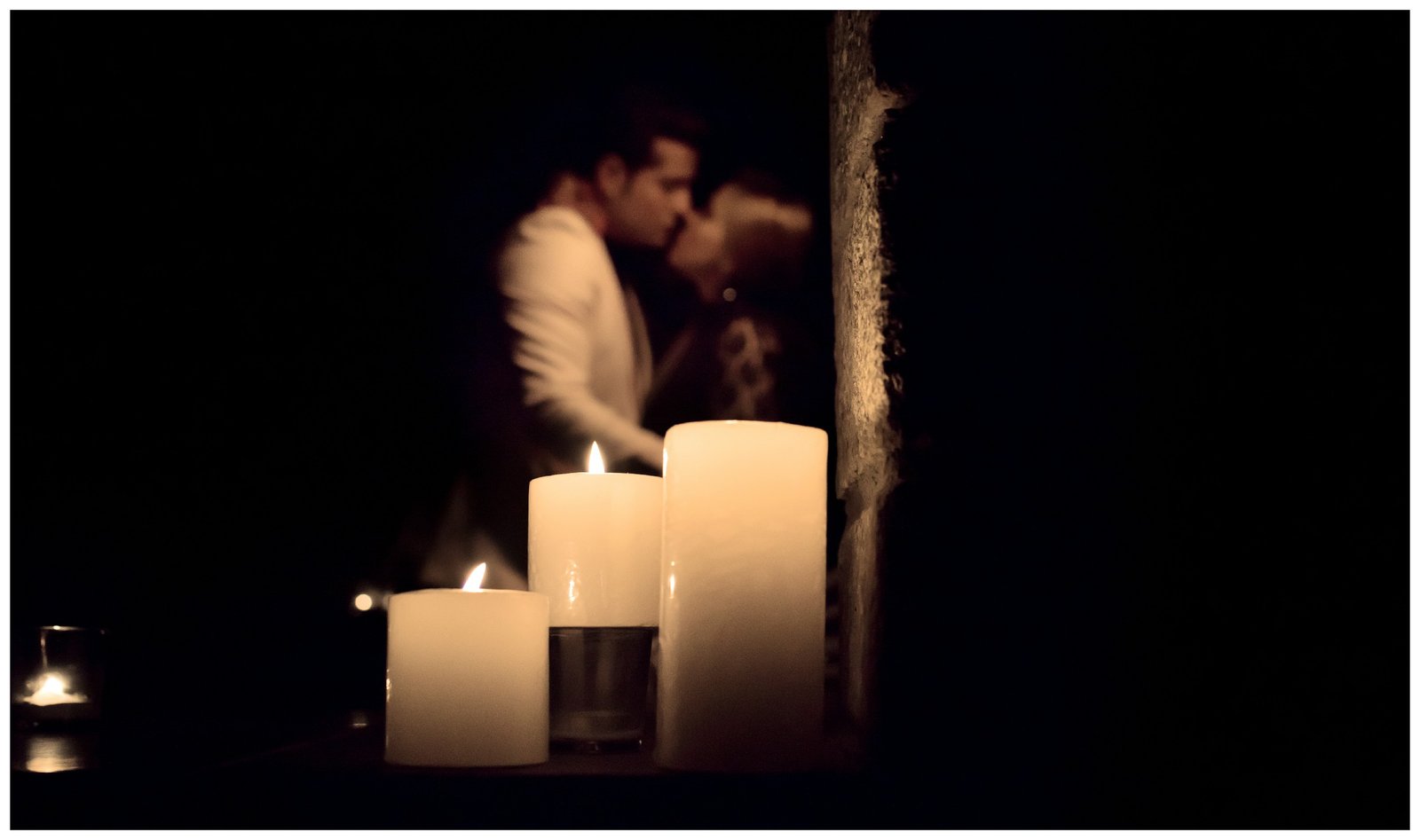 Couple in candlelight dark moody pre-wedding portrait, dramatic Indian pre-wedding photography