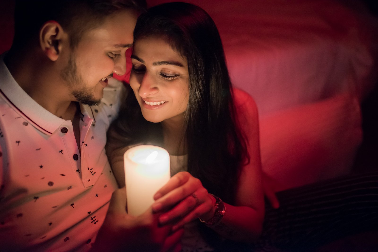 Romantic candlelight pre-wedding portrait of couple, professional Indian wedding production house