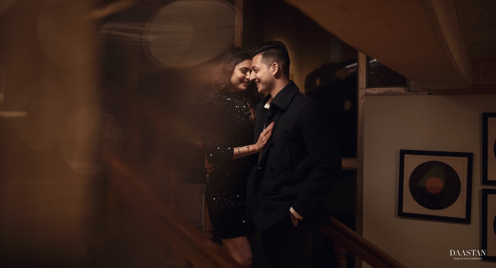 Dark indoor candid pre-wedding portrait of couple, moody Indian couple photography
