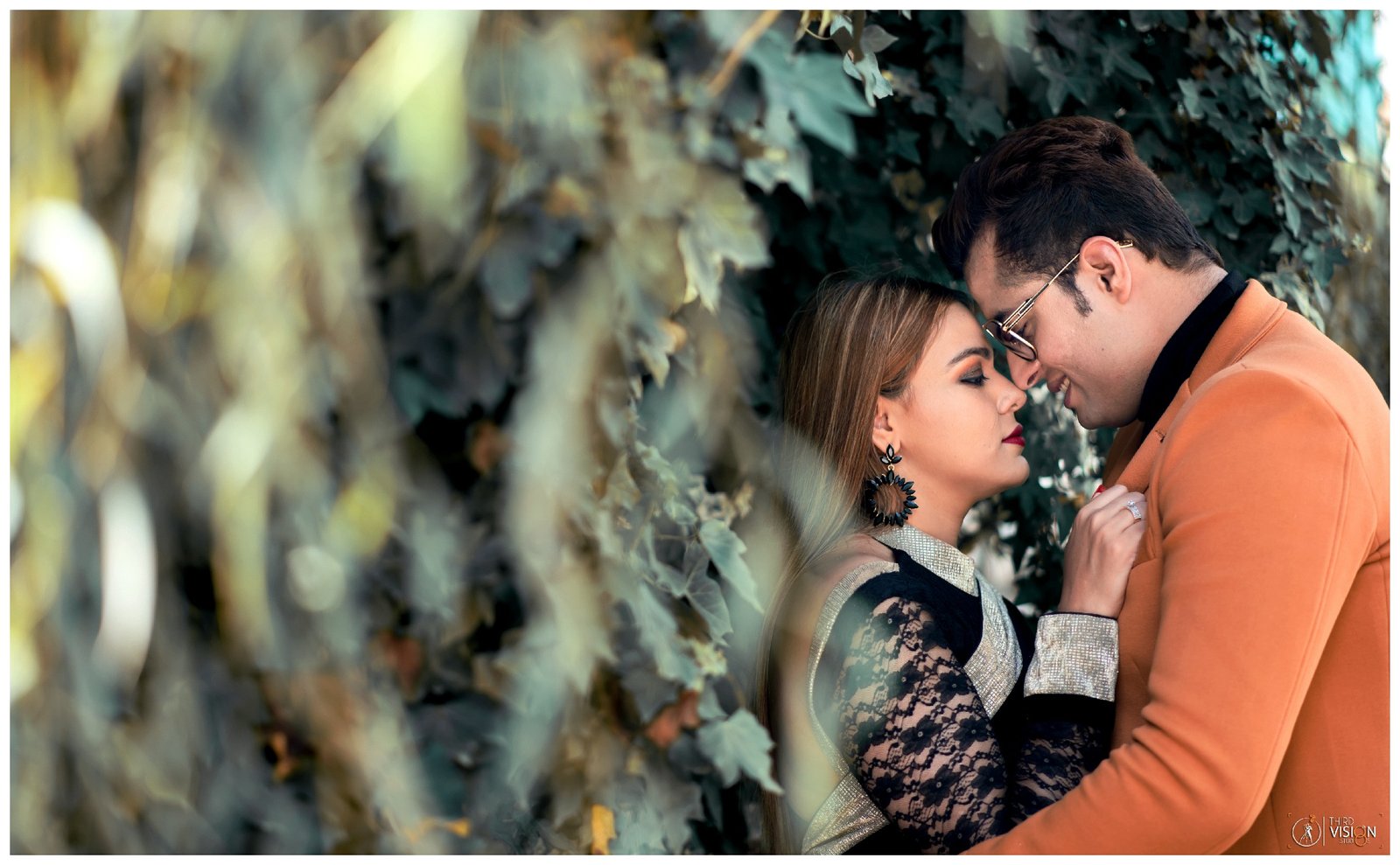 Candid couple portrait in forest during pre-wedding shoot, natural Indian couple photography