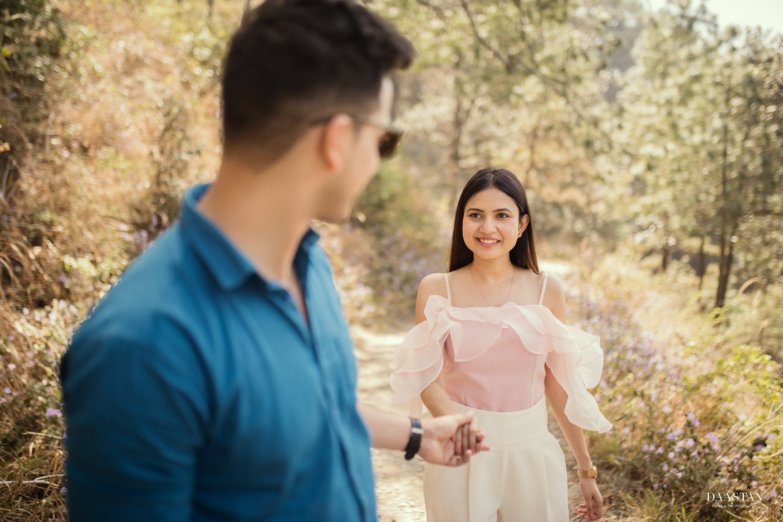Couple outdoor portrait in forest during pre-wedding shoot, natural Indian couple photography
