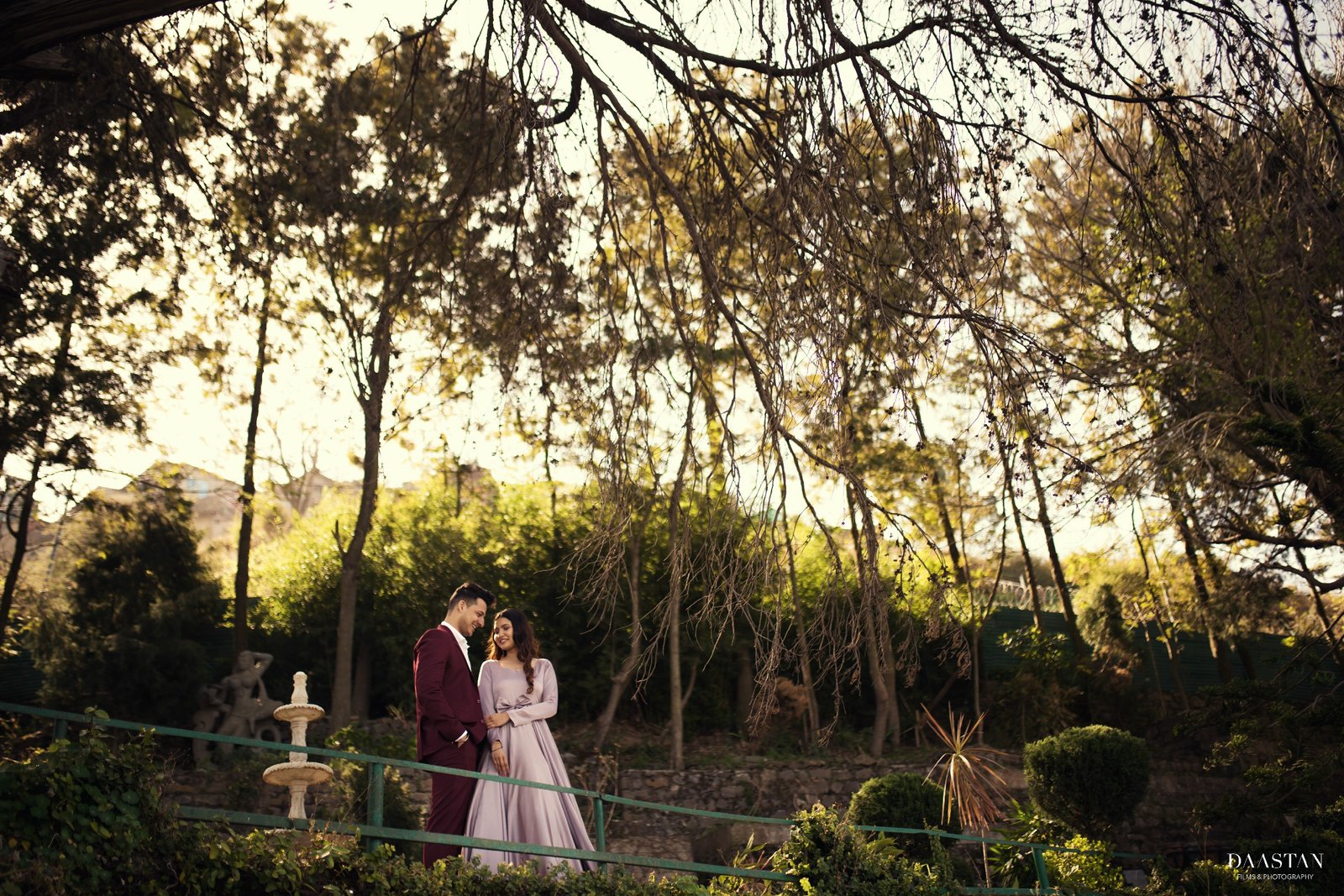 Couple in golden hour forest light during pre-wedding shoot, Indian couple photography