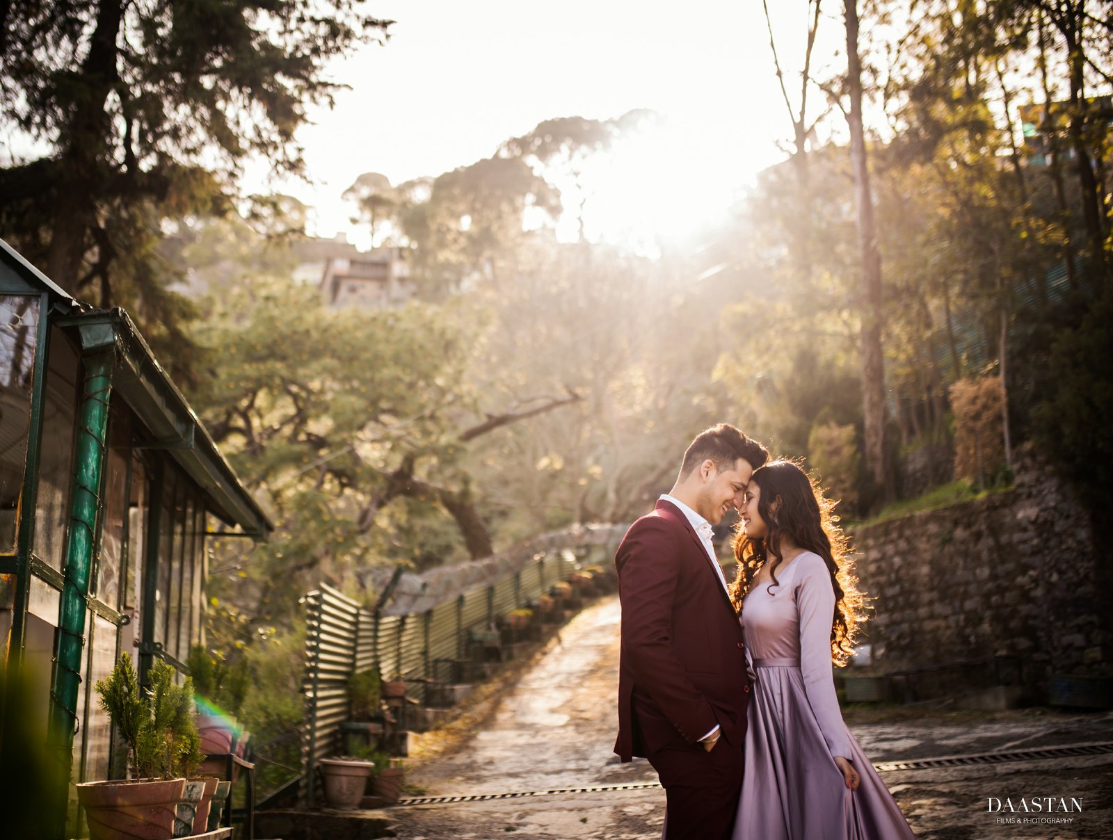 Romantic couple at greenhouse in golden hour light during pre-wedding shoot, Indian photography