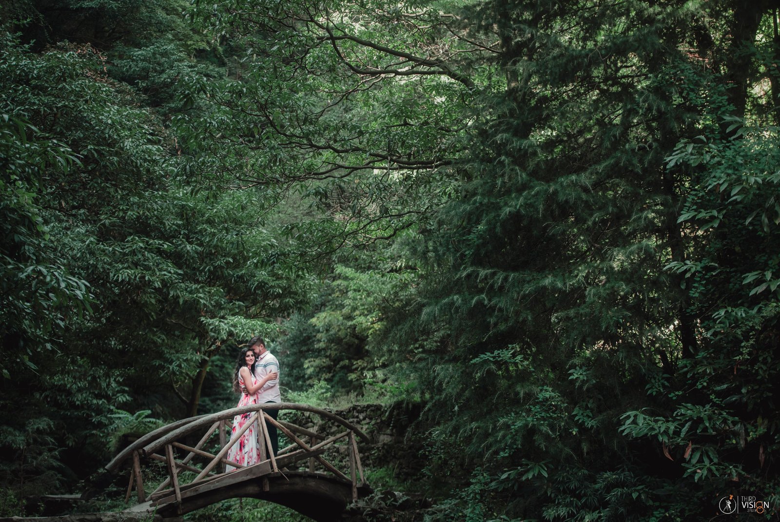 Couple in lush green forest during outdoor pre-wedding shoot, natural Indian couple photography