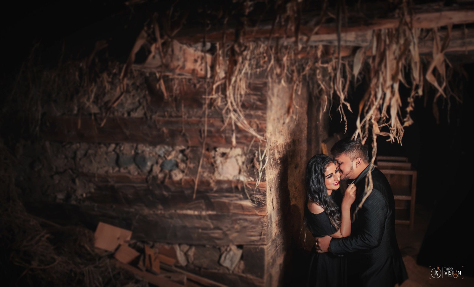 Couple in dark heritage cave location during pre-wedding shoot, moody Indian couple photography