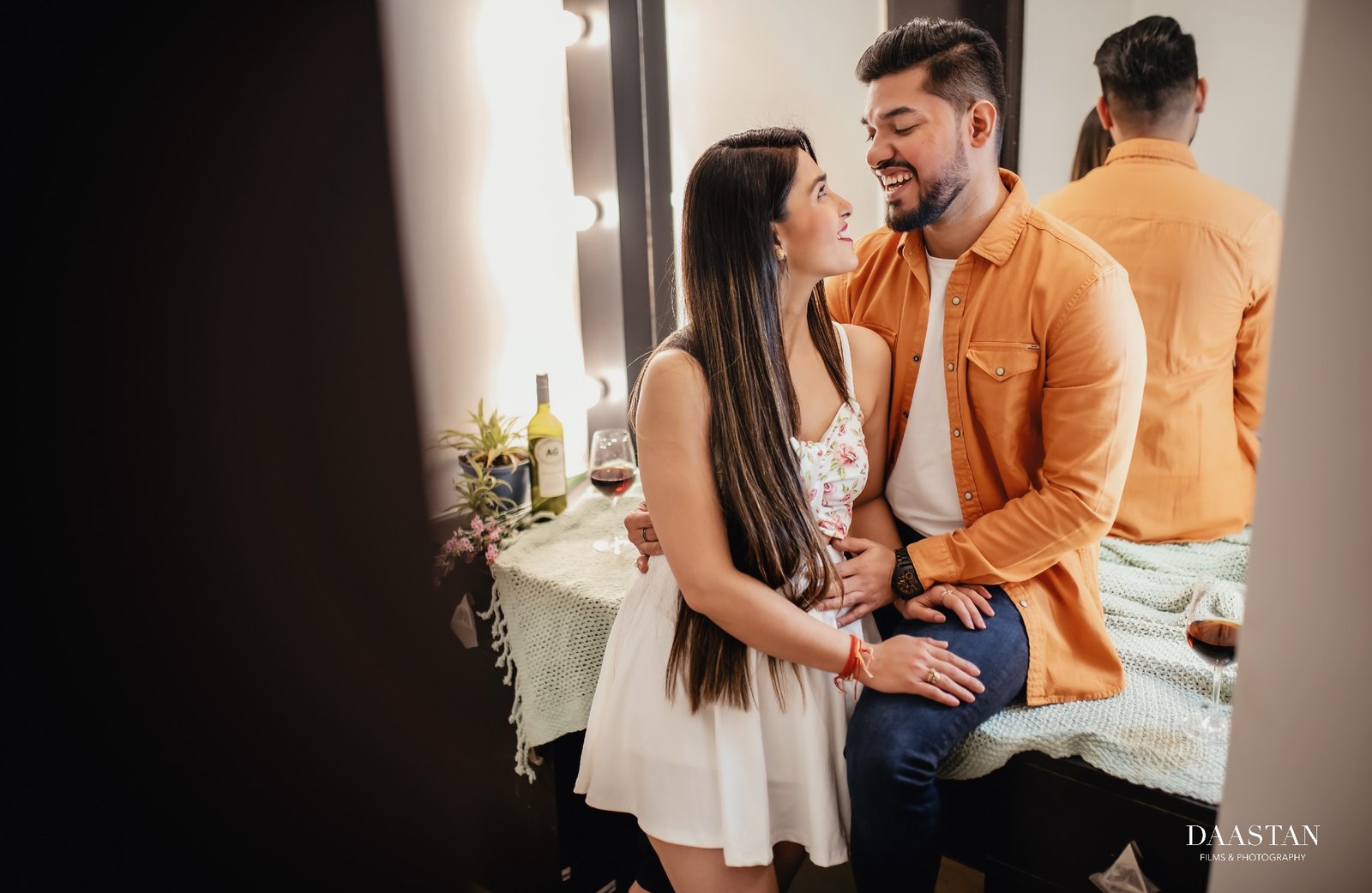 Couple in soft window light during indoor pre-wedding shoot, cinematic Indian photography