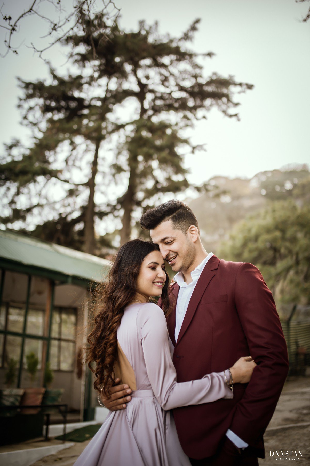 Couple in maroon suit at greenhouse during pre-wedding shoot, Indian couple photography