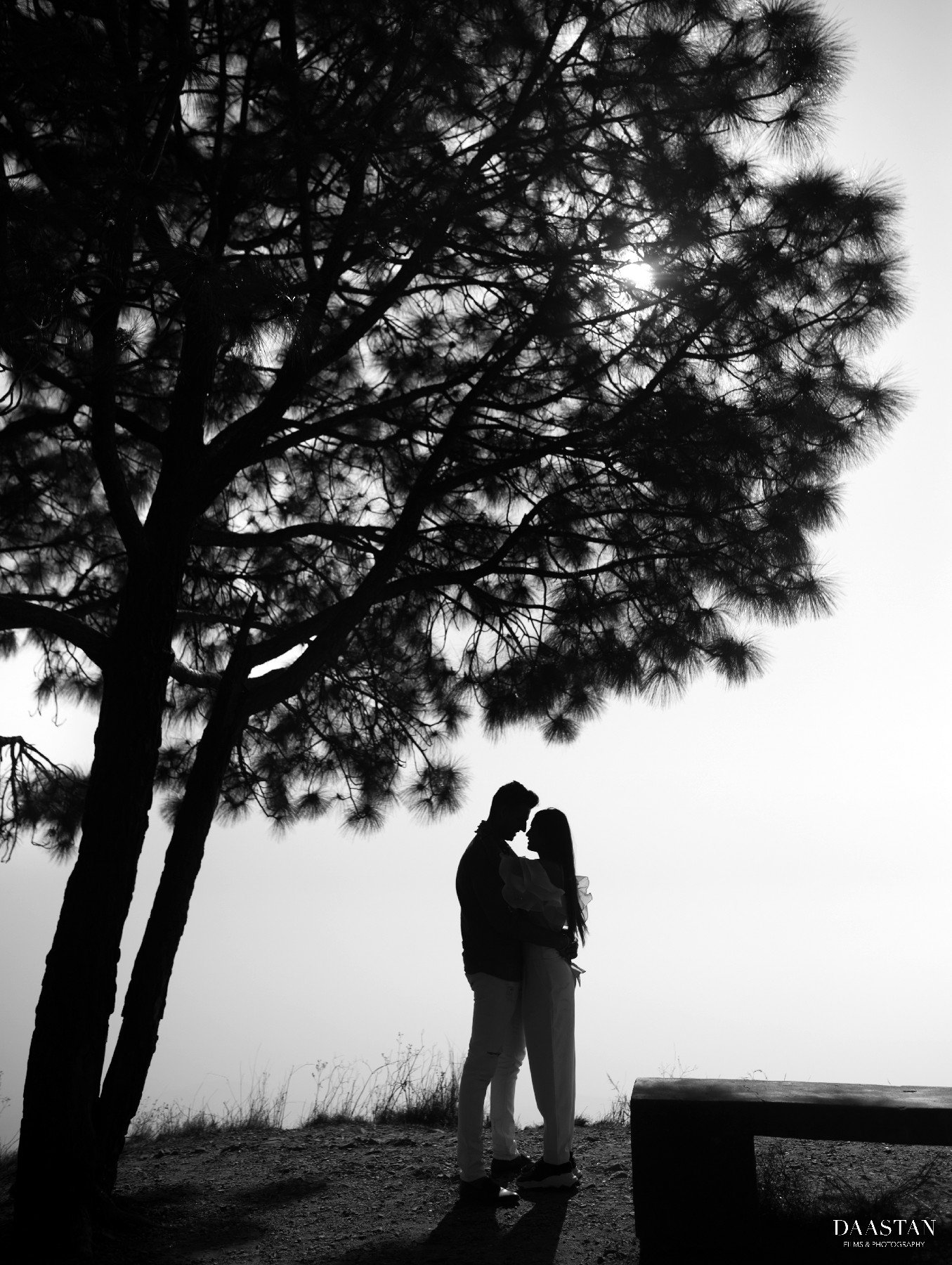Couple silhouette in misty mountain landscape during pre-wedding shoot, cinematic Indian photography