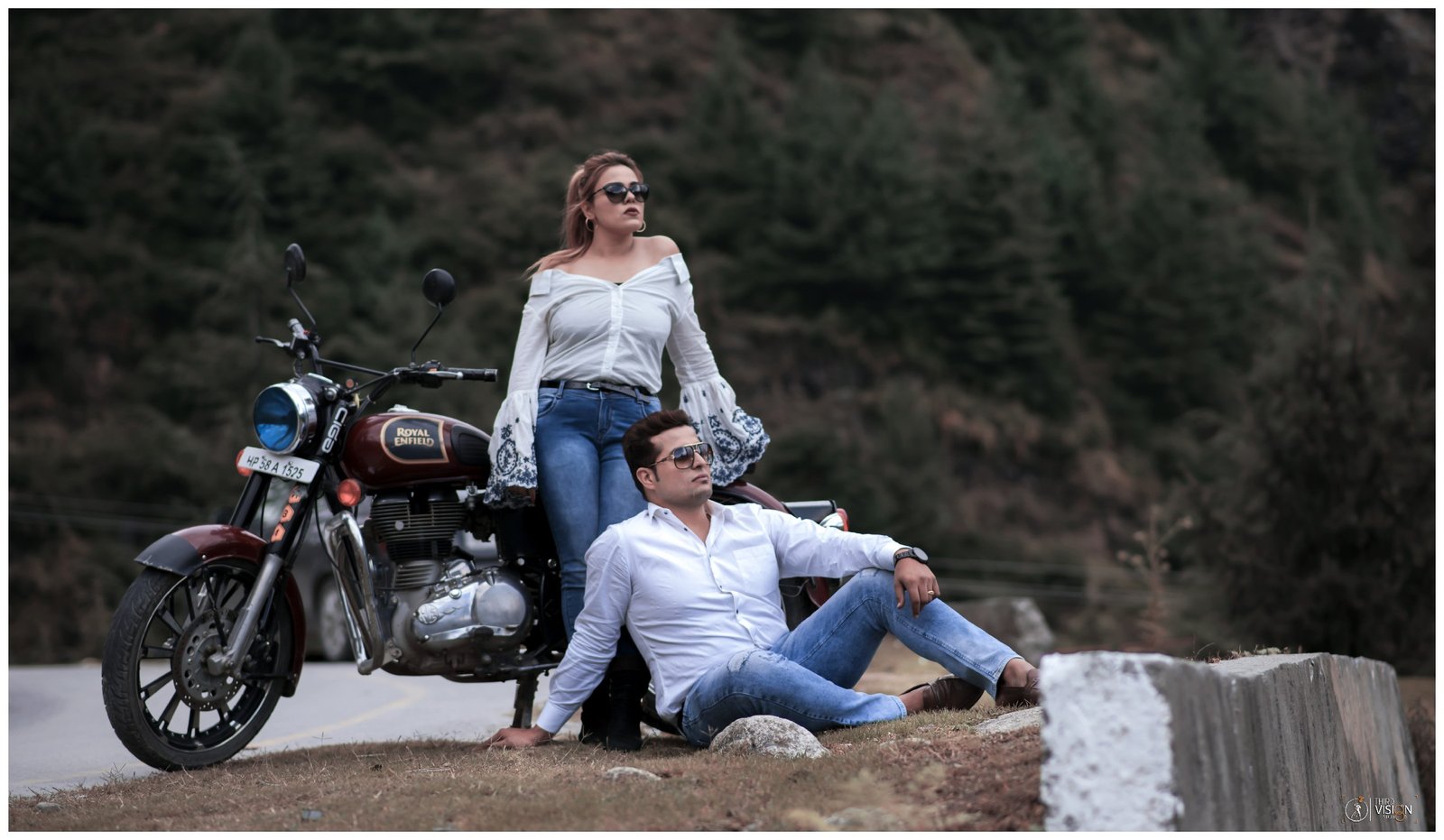 Couple with motorcycle in mountain setting during pre-wedding shoot, lifestyle Indian photography