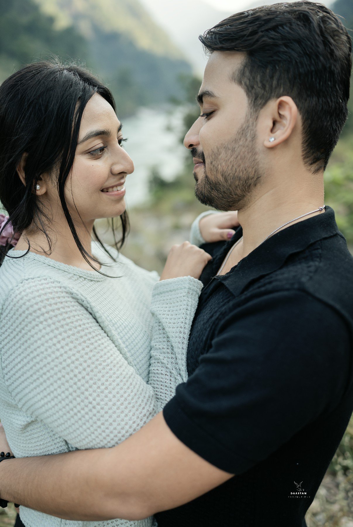 Romantic couple portrait by mountain river during pre-wedding shoot, Indian couple photography