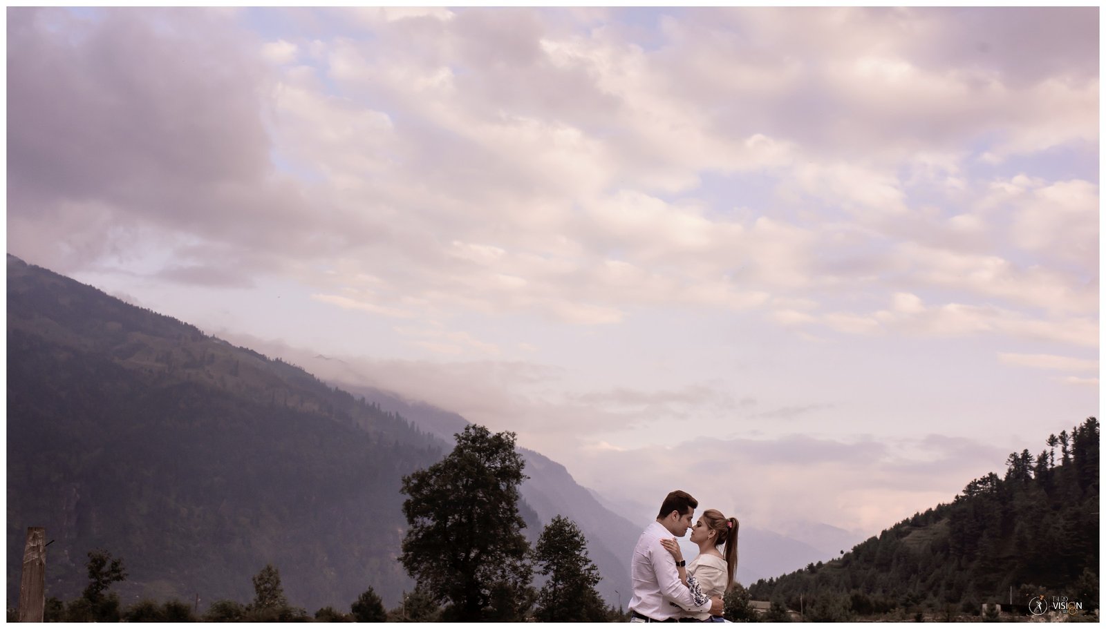 Couple at mountain sunset during pre-wedding shoot, golden hour Indian couple photography