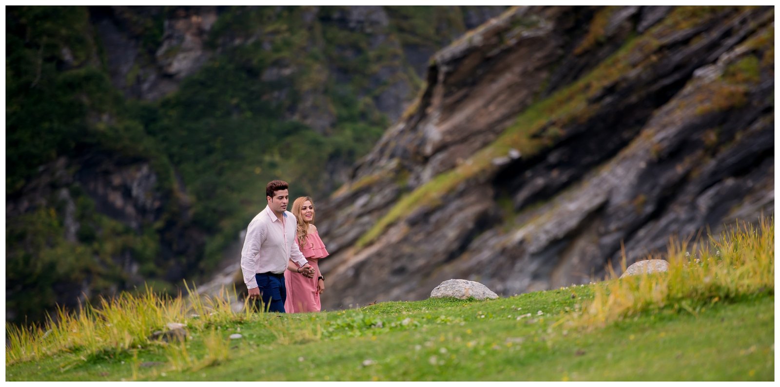 Couple in green mountain waterfall setting during pre-wedding shoot, Indian nature photography