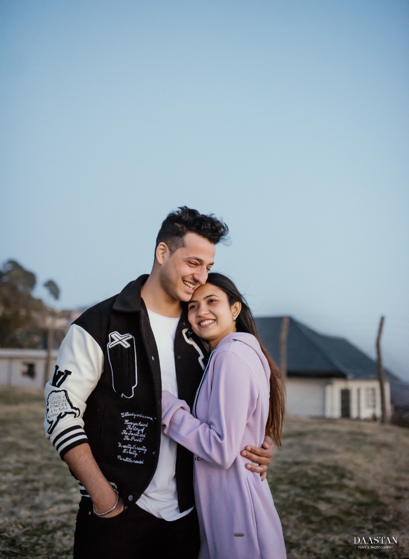 Fun casual outdoor pre-wedding portrait of couple, candid Indian photography