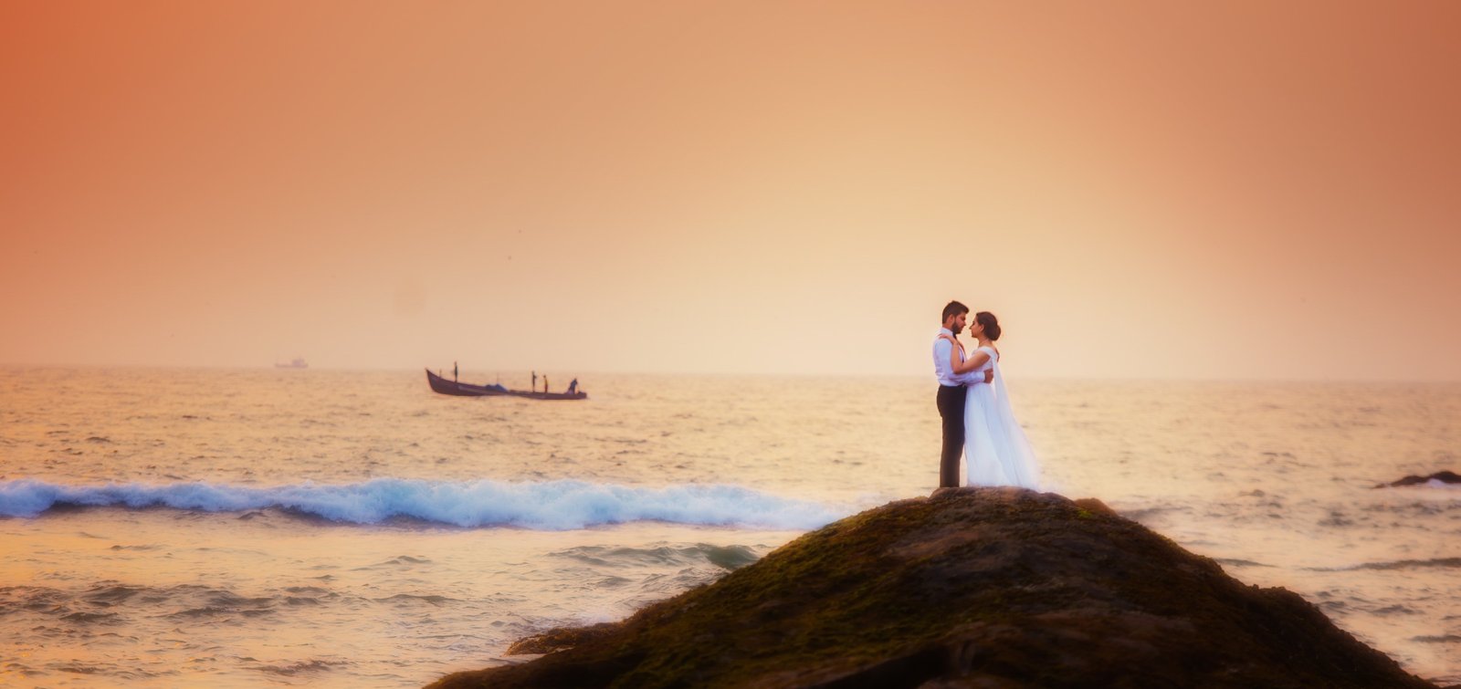 Couple silhouette at sea sunset during pre-wedding shoot, cinematic Indian couple photography