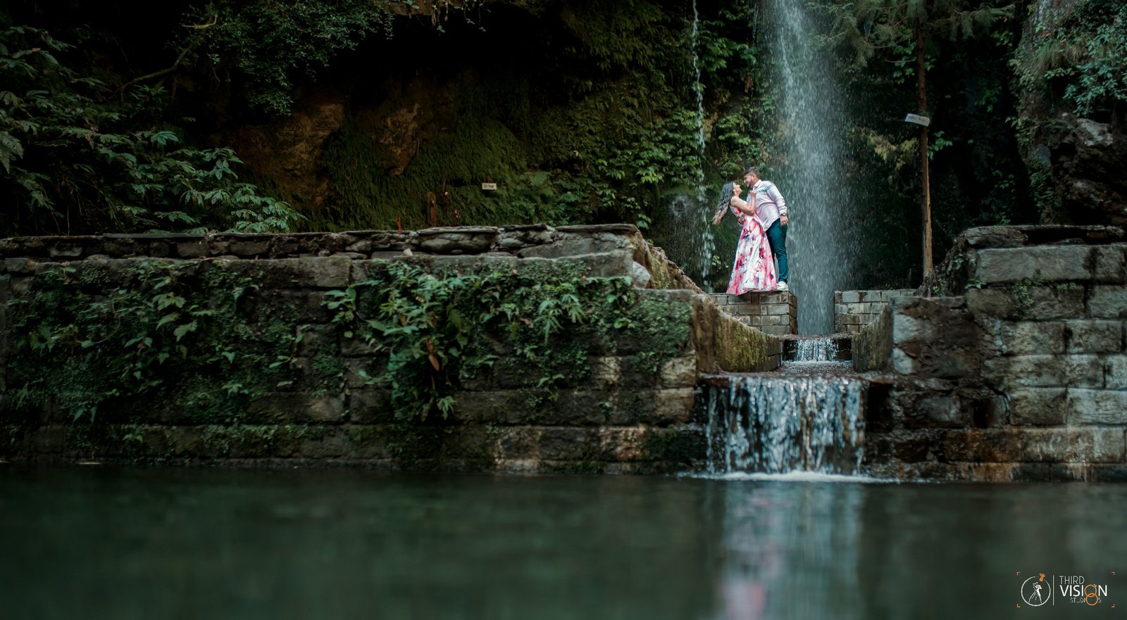 Couple at waterfall garden during outdoor pre-wedding shoot, Indian couple photography