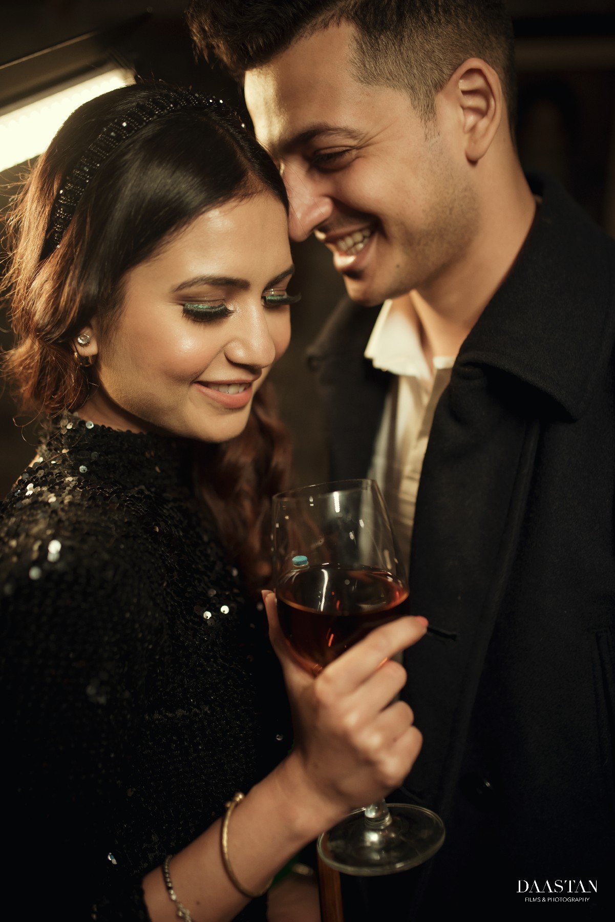 Couple at wine bar during fun pre-wedding shoot, candid Indian couple photography